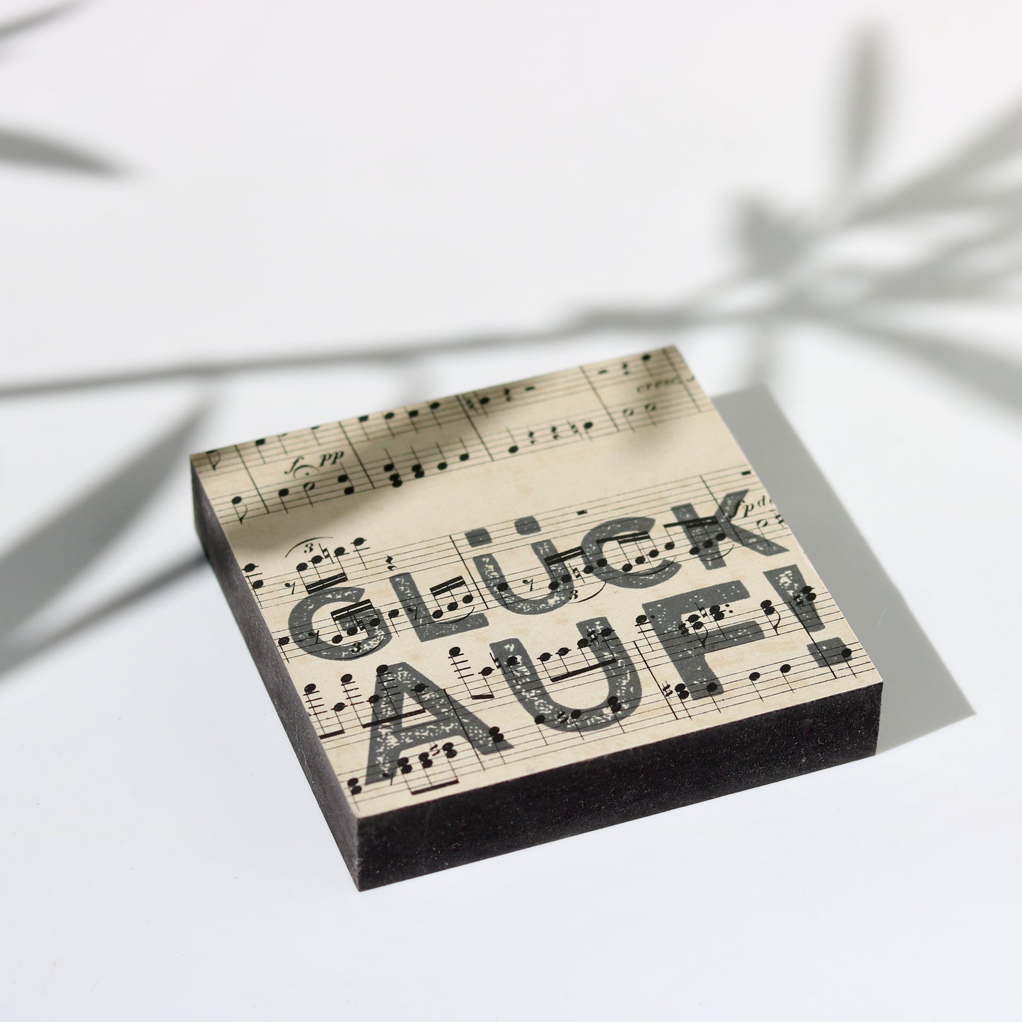 Vintage Bild mit historischem Notenpapier und Schriftzug Glück Auf!
