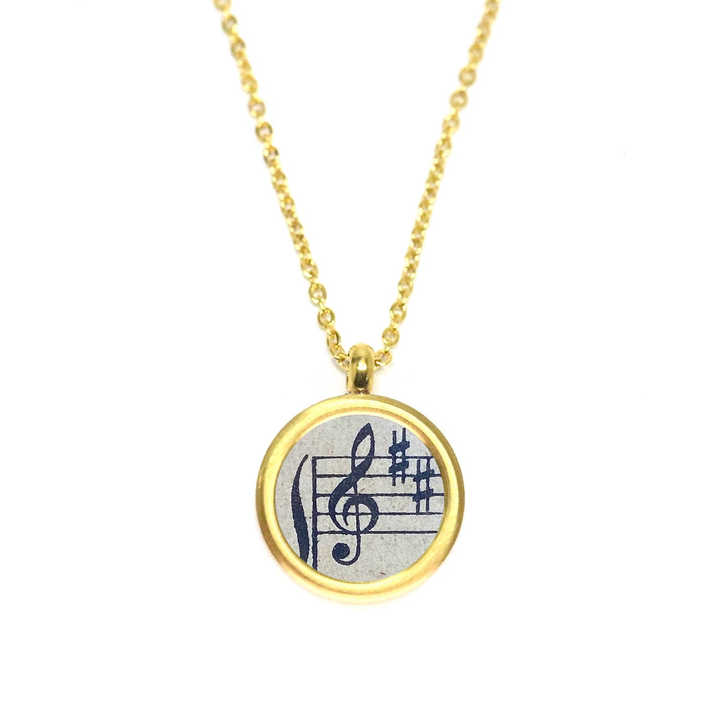 Medaillonkette mit Violinschlüssel aus historischem Notenblatt im Typewriter Gold Design