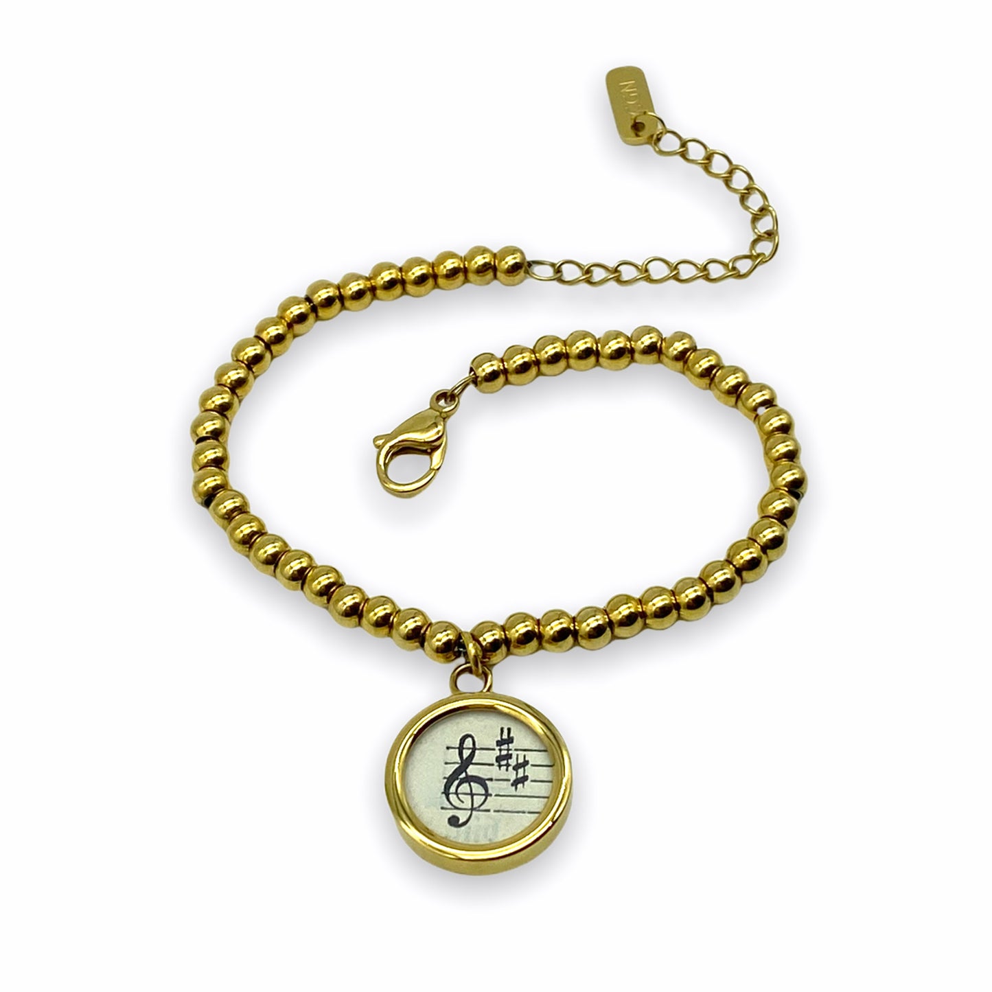 Armband mit Violinschlüssel aus historischem Notenblatt im Typewriter Gold Design
